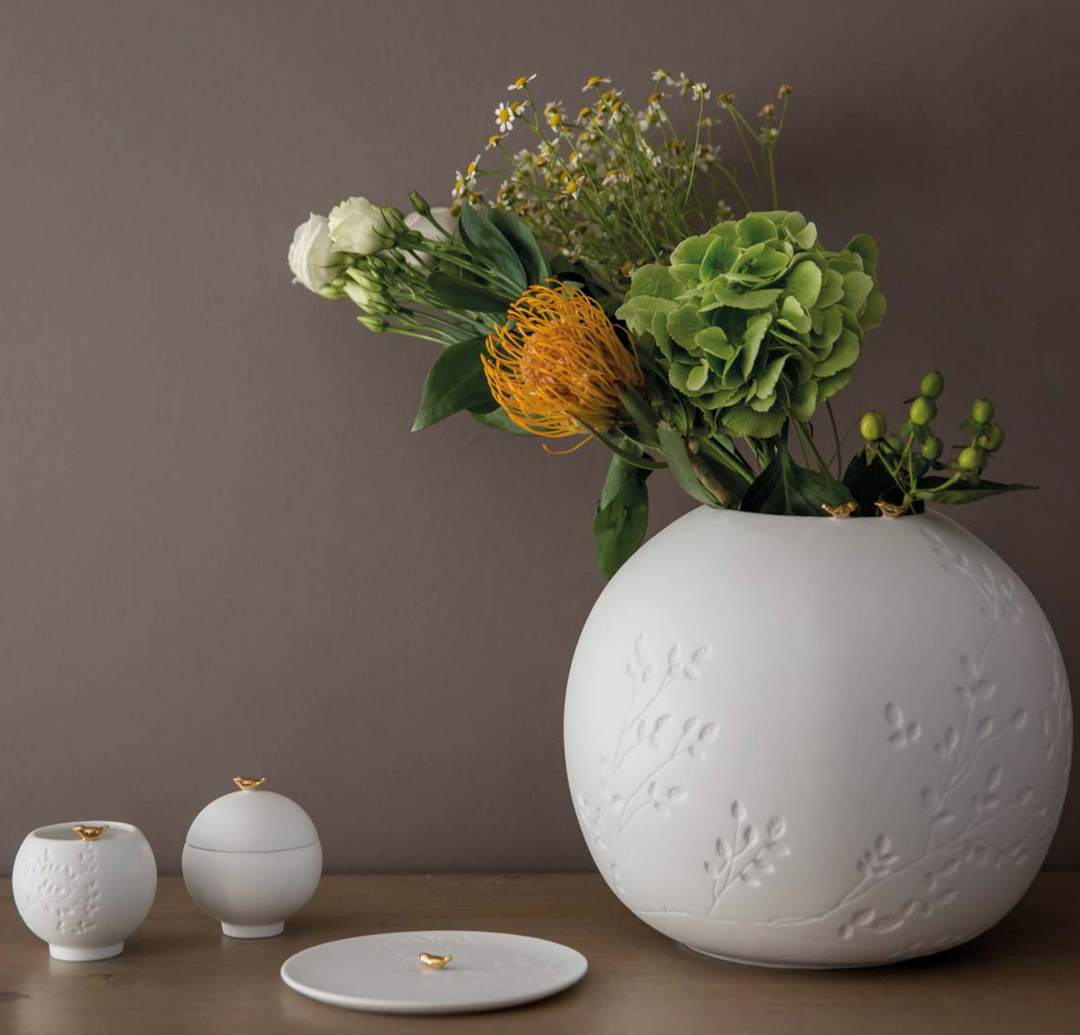 Räder, Vase, Vogel
