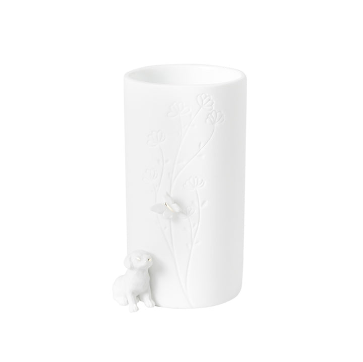 Räder, Vase, Hund sitzend